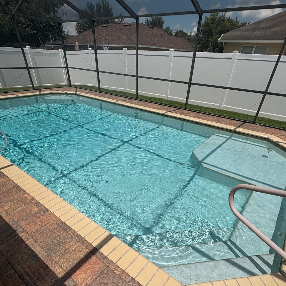 Sparkling blue client pool with sun shelf after weekly service